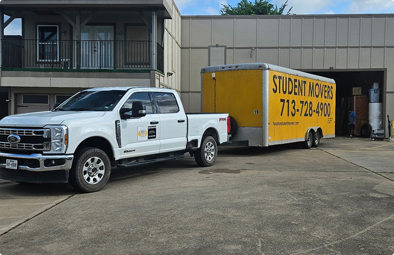 Truck towing a Student Movers PODS.